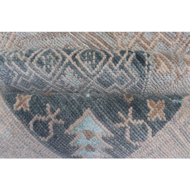 Modern Hand Knotted Khotan in Wool With All-Over Medallion Design in Blue and Earthy Tones For Sale - Image 11 of 13
