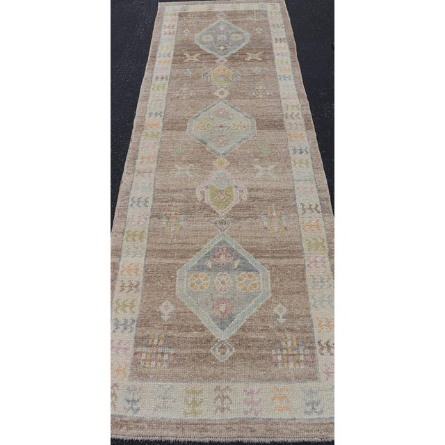 Early 21st Century Turkish Oushak Runner With Soft Brown Field and Pale Blue Geometric Medallions For Sale - Image 5 of 12