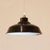 1950s industrial ceiling light. Black enameled metal (exterior) and white enameled metal (interior). Requires one E14...