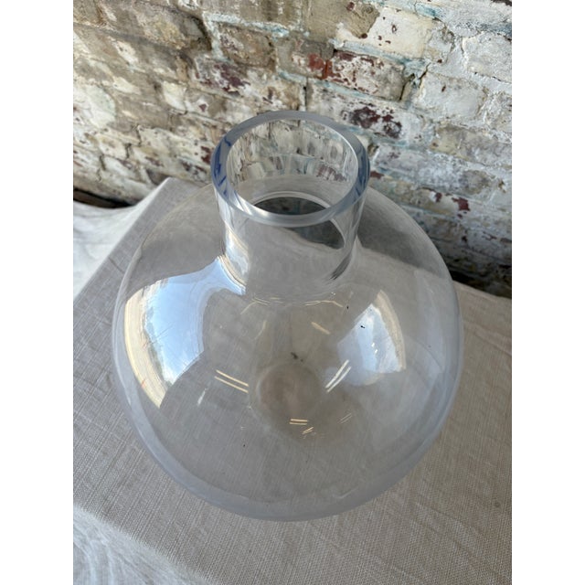 Elevate your interior styling with this stunning large glass demijohn vase—an effortlessly chic vessel that brings light,...