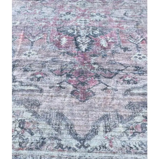 Design Plus Gallery presents a 10ft 6in x 13ft Washable Nostaglia Area Rug. The rug has a softly worn medallion pattern...