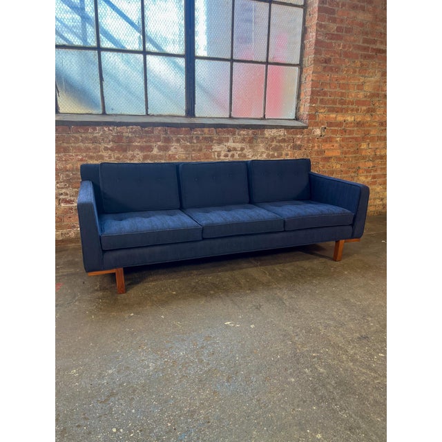 Beautiful mid-century modern sofa by Marshall Field’s, newly upholstered in deep navy blue fabric with all new foam. The...