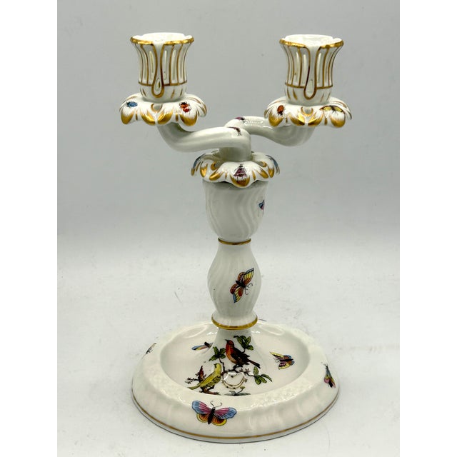 Elegant vintage porcelain candelabrum by Herend of Hungary in the celebrated Rothschild Bird pattern. The two scrolling...