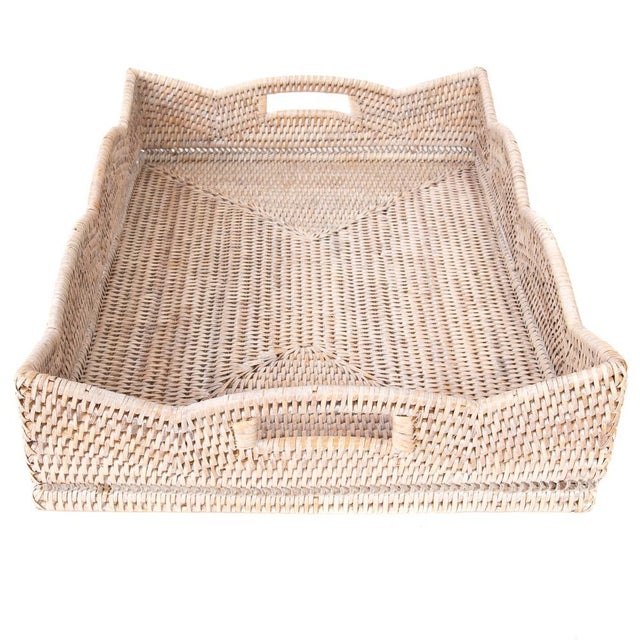 Our Scallop Collection rattan storage baskets, serving trays, and ottoman trays will instantly add a gorgeous touch to any...