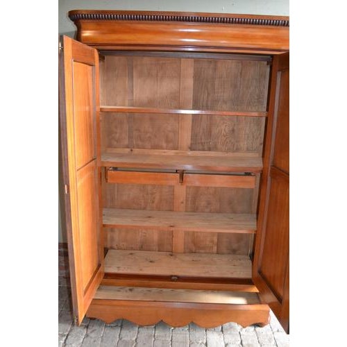 of a 19th-century Dutch mahogany Biedermeier maid's cabinet. The height is 183 cm. The width is 124 cm. The depth is 44...