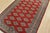 A tribal Bokhara Jaldar rug hand-knotted with fine wool on a cotton foundation. This rug features rows of repeating...