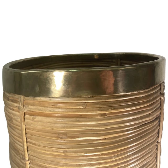 Here we have another lovely umbrella stand or basket. This bin is in good condition with the normal patinated brass and...