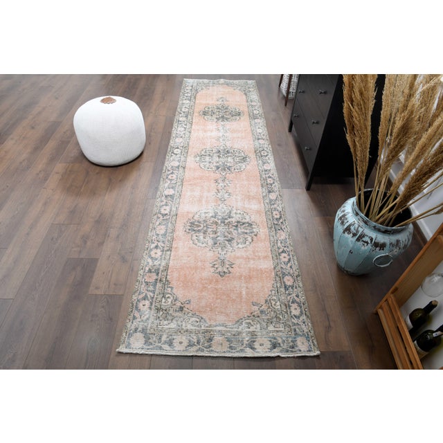 Vintage Hand-Knotted runner rug is a semi-antique vintage runner rug. The '70s Eastern region of Anatolian's unique rug is...