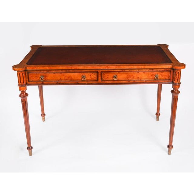 This is a beautiful vintage birdeye maple writing table in the manner of Gillows, mid-20th century in date. This gorgeous...