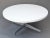 A cool MCM Eames style 1970s. aluminum base with white laminated round top coffee table.