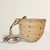Handwoven by the Yanomami in the 20th century, its broad, beautifully irregular form is made entirely from natural fiber,...