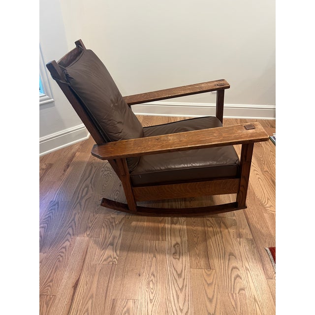 Stickley style rocker with Quaint Furniture label (1905-1920 period). 33" wide, 36" deep. Very sturdy and in solid shape,...