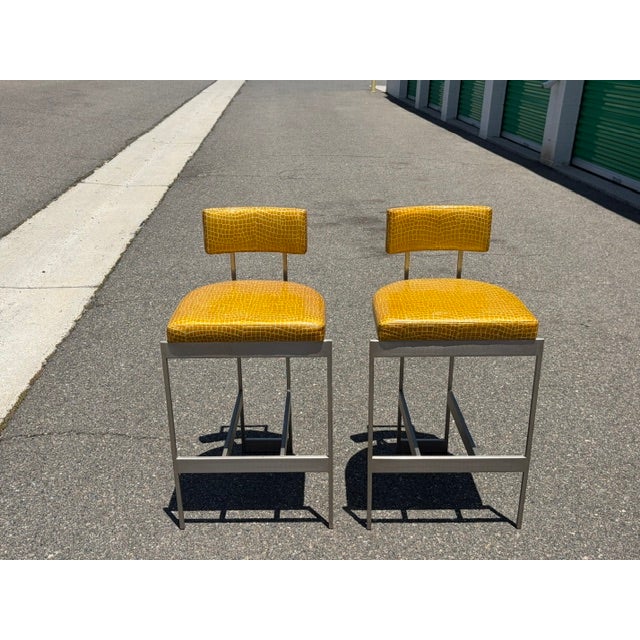 Powell & Bonnell "Alto" Counter Stools – Pair Satin Nickel with Custom Chartreuse Stamped Leather A stunning pair of...