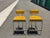 Powell & Bonnell "Alto" Counter Stools – Pair Satin Nickel with Custom Chartreuse Stamped Leather A stunning pair of...