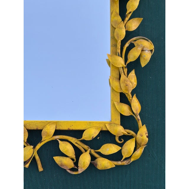 Very heavy wrought iron framed Italian tole mirror with aver 100 leaves..