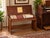 Authentic vintage Hammond organ bench crafted in rich mahogany, featuring a lift-top lid with an integrated interior...