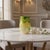 Beautiful hand-blown studio art glass vase featuring creamy-yellow glass with vibrant emerald green feathered swirls...