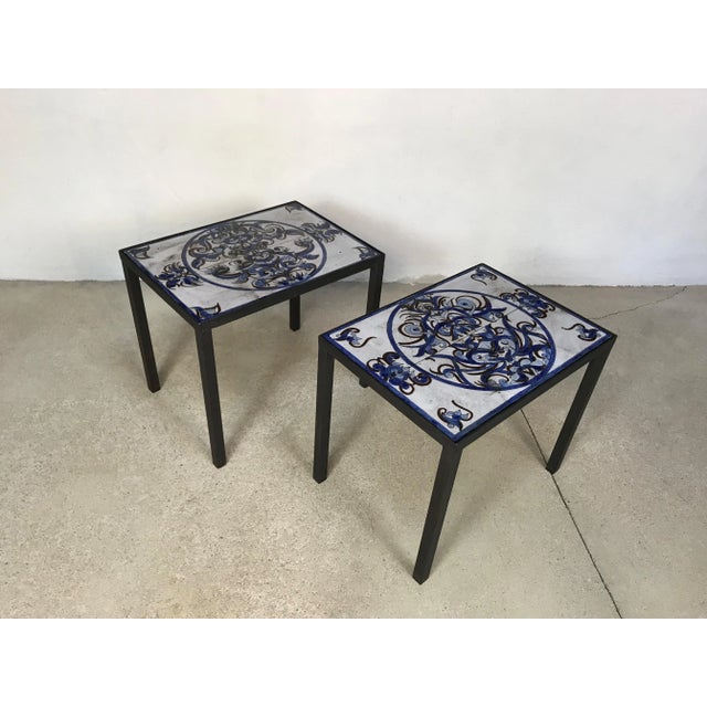This pair of side tables or nightstands was made in Italy in 1974. The pieces feature steel frames, each carrying loose...
