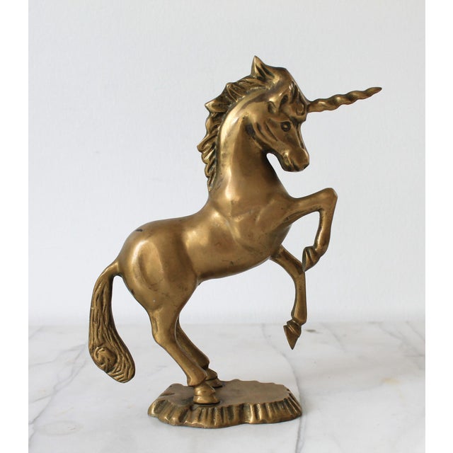 Vintage solid brass unicorn figure. Weighs 2lbs 15oz. No makers mark. Patina.