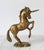 Vintage solid brass unicorn figure. Weighs 2lbs 15oz. No makers mark. Patina.