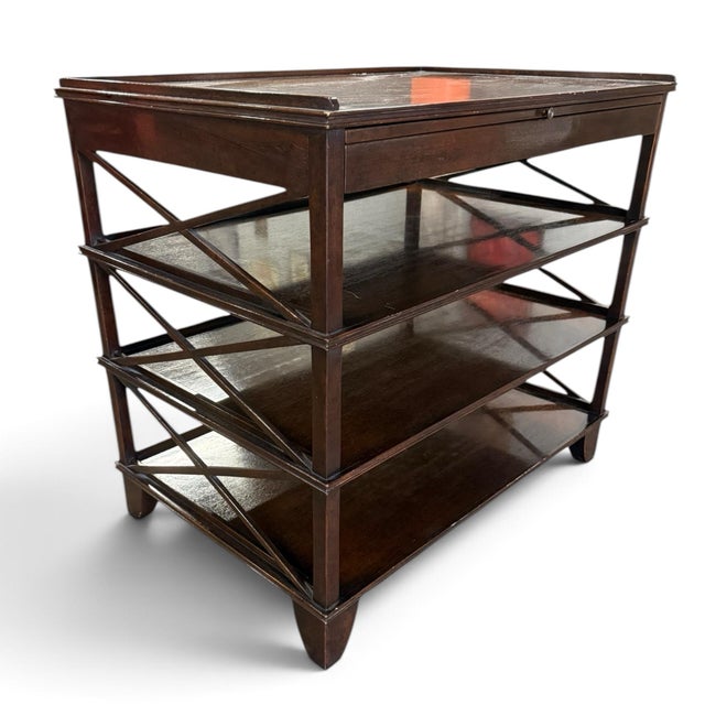 A beautiful pair of side tables from sought-after designer Rose Tarlow. Handmade of mahogany with a dark mahogany finish....