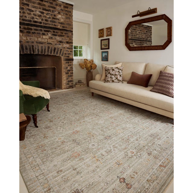 The Ida Collection from Chris Loves Julia x Loloi is a vintage-inspired area rug with a soft, subtly textured pile similar...