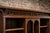 A wonderfully characterful english arts & crafts solid oak bookcase dating from around 1910, featuring the charming carved...