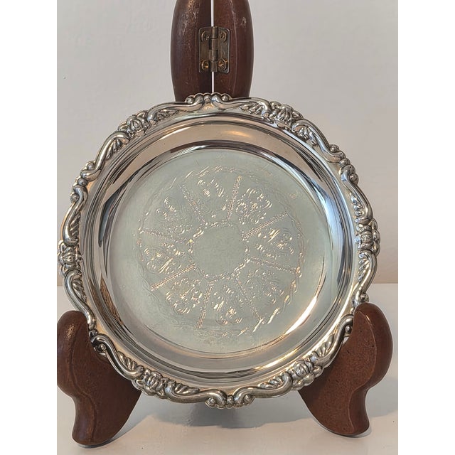 Elegant vintage Italian silver-plated small dish featuring an intricate Rococo-inspired design. The center is decorated...