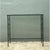 This vintage wrought iron console table balances architectural restraint with graceful, hand-forged detail. A slender...