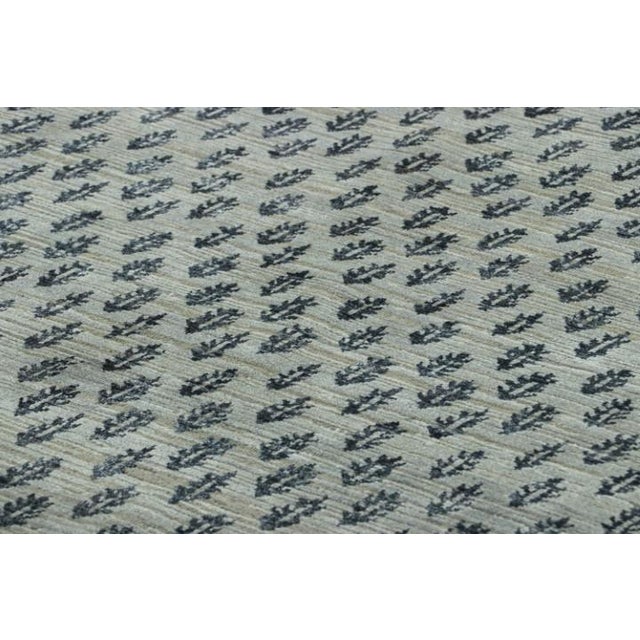 Hand-knotted in wool and silk, this 8x10 rug design is a bold addition to the Block Print line of Rug & Kilim’s Modern...