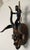 Guro Style African Carved Wood Horned Antelope Mask with Figure, Côte d’Ivoire Striking Guro-style African carved wood...