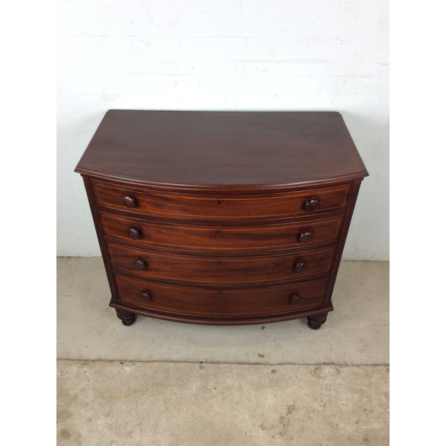 This chippendale style chest of drawers from the Mid-Atlantic region of the United States features hardwood construction,...