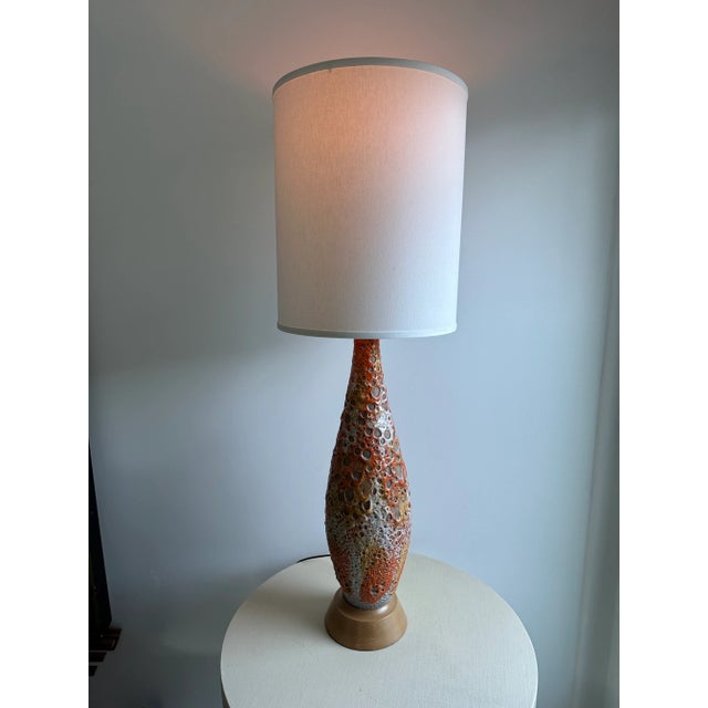 Beautiful Tall Mid-Century Lamp from a Palm Springs Estate. Heavy Lava glaze in orange, white and gold over stoneware...