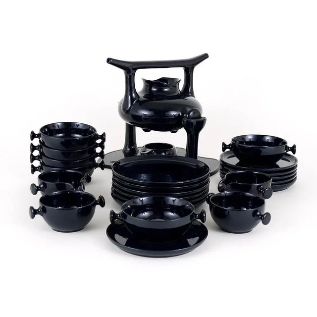 A beautiful tea set made of black glazed stoneware, designed by Luigi Colani in 1973. Executed by Porzellanfabrik...