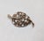 1949-50 goldtone openwork with curls leaf with clear round, square and oval rhinestones brooch with security clasp. Marked...