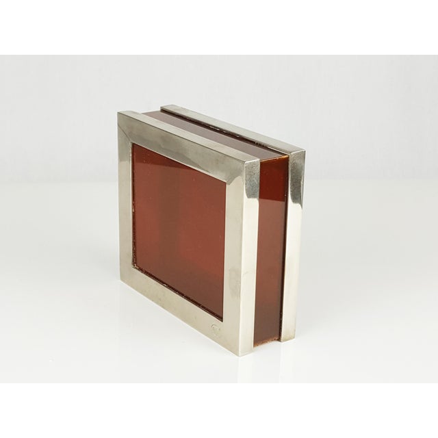 This metal & plastic box was produced in the 1960s. It is made from nickel plated brass frame and plastic faces. the box...
