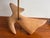Dove Wood Carved Table Lamp with brass tube that has lamp socket at one end and wood ball at other end where the wire...