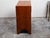 An English Campaign teak wood chest from the 19th century, with brass hardware and bracket feet. Created in England during...