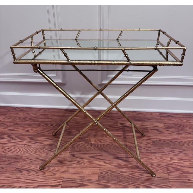 Offering up a Hollywood Regency to Palm Beach aesthetic vibe is found in this collapsible tray table. Consisting of faux...