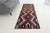 This is a vintage Turkish Oushak rug from the Mid 20th Century. The piece was hand-knotted.