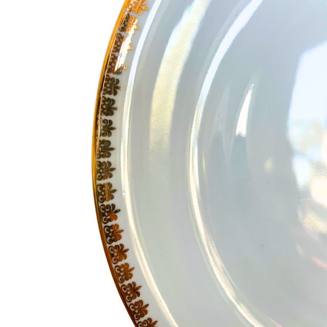 A refined Limoges porcelain dinner service embodying the quiet elegance of mid-century French tableware. The beautifully...