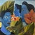 Three figures in deep blue profile face each other in a tropical setting of hibiscus flowers and warm golden foliage. The...