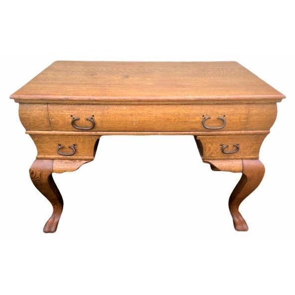 This graceful Edwardian quarter sawn oak piece could serve as a library table or a writing desk. It's so great looking...