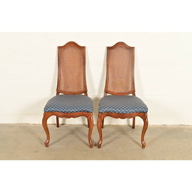 A gorgeous pair of French Provincial Louis XV style side chairs or dining chairs In the manner of Baker Furniture USA,...