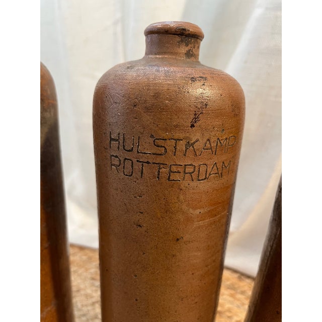 These Dutch salt-glazed stoneware gin bottles are from the historic Amsterdam distillery, Hulstkamp & Zoon & Molijn, which...