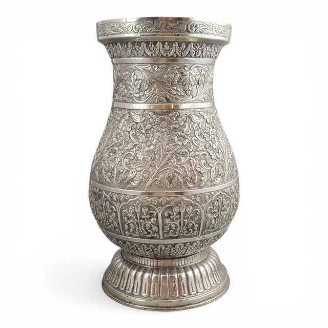 This exceptional Indian silver baluster vase is a work of rare scale, artistic strength and decorative authority, created...