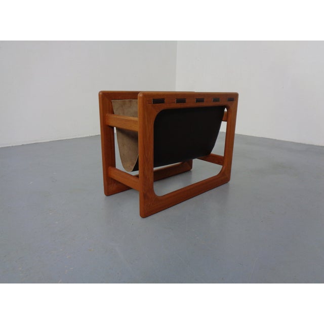Danish newspaper stand with teak frame and leather shelf by Aksel Kjersgaard from the 1960s. I have official proof of...