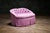 Petite Skirted Loveseat vintage upholstered loveseat in pink striped fabric with a button-tufted kidney-shaped back. This...