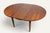 An elegant extendable dining table dating from the 1960s, characteristic of modernist furniture from that period. Its...