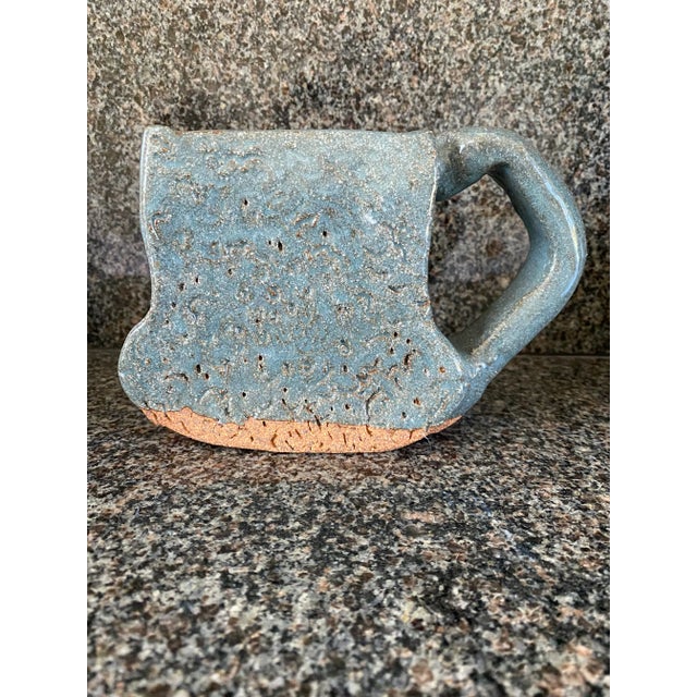 Awesome art piece handled vase created from very heavy terra cotta, then partially glazed in a blue/ grey/green shade....